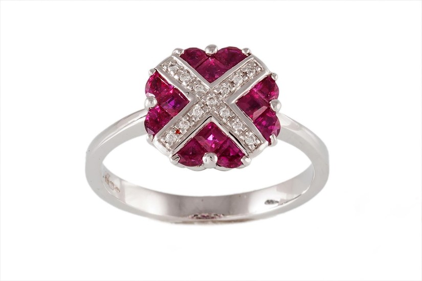 A RUBY AND DIAMOND CLUSTER DRESS RING, with rubies of approx...