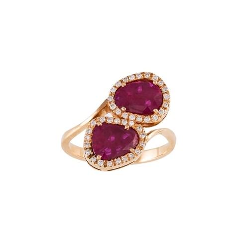 A RUBY AND DIAMOND DOUBLE CLUSTER RING, of cross over design...