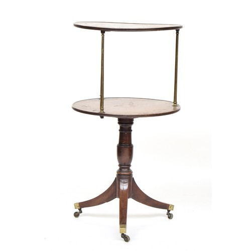 A Regency mahogany two tier dumb waiter, the two moulded tie...