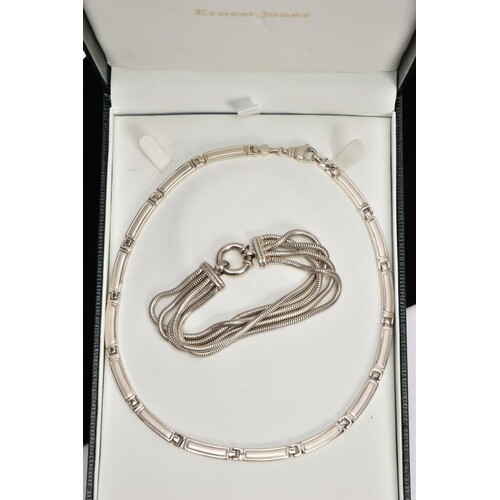 A SILVER ARTICULATED NECKLACE AND A BRACELET, the silver art...