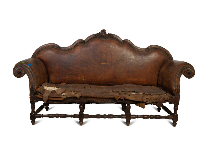 A Spanish Baroque Carved Walnut Leather-Upholstered Sofa