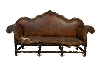 A Spanish Baroque Carved Walnut Leather-Upholstered