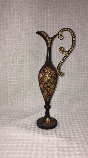 A Spanish Toledo bottle made of old iron with gold ornaments