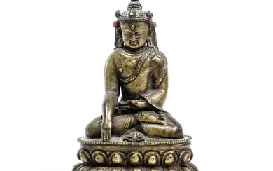 A Tibetan copper-alloy figure of Buddha 18th/19th century The Buddha wearing a...