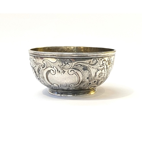 A VERY EARLY 19TH CENTURY SILVER BOWL DECORATED WITH REPOUSE...