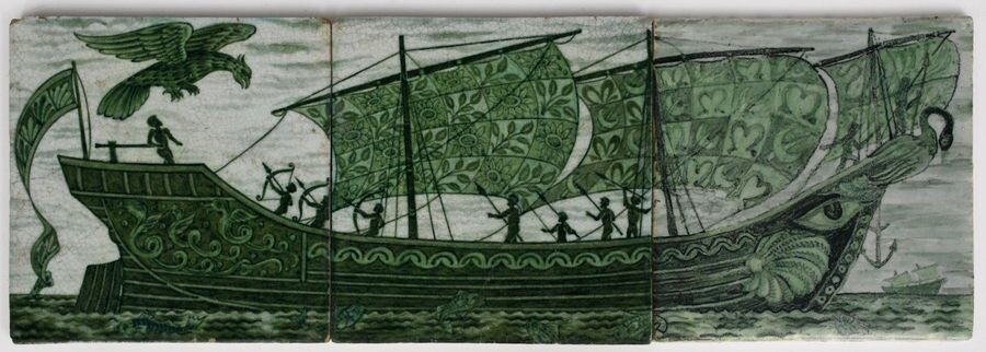 A William De Morgan Late Fulham Period Galleon three tile panel, painted in shades of green with a classical long ship sailing on a calm sea, a large eagle bird attacking from the stern side and being repelled by archers, another vessel sailing on the...