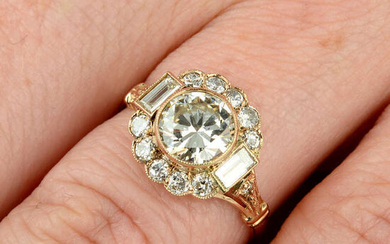 A brilliant-cut diamond cluster ring, with baguette-cut diamond highlights.
