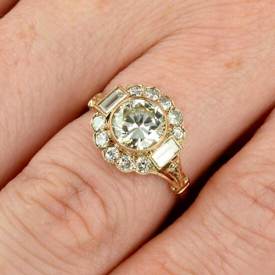 A brilliant-cut diamond cluster ring, with baguette-cut