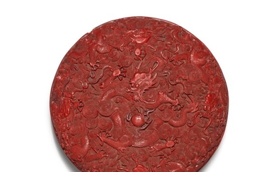 A carved cinnabar lacquer 'dragon' box and cover, Qing dynasty, Qianlong period | 清乾隆 剔紅遊龍趕珠紋圓蓋盒