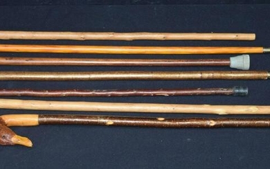 A collection of wooden walking canes 93cm. (7)