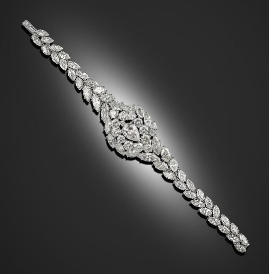 A diamond bracelet, centred with a pear-shaped diamond...