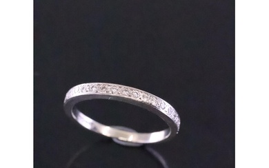 A diamond set wedding band finger size K set in 18ct gold