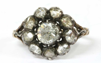 A foil-backed diamond cluster ring
