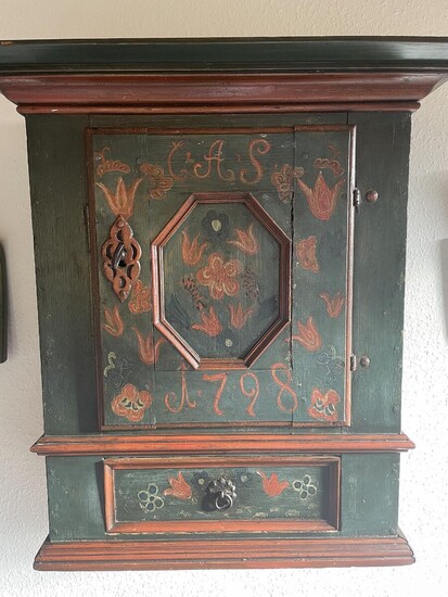SOLD. A greenpainted wall cupboard, door and drawer in front. Dated 1798. H. 64. W. 51. D. 26 cm. – Bruun Rasmussen Auctioneers of Fine Art