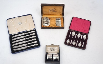 A group of four cased sets of silver, comprising: six Victorian fiddle pattern teaspoons, Newcastle, 1864, Thomas Sewell I; a pair of napkin rings, Birmingham, 1924, Docker & Burn Ltd, dia. 4.7cm; six teaspoons, Sheffield, 1929, William Gallimore &...