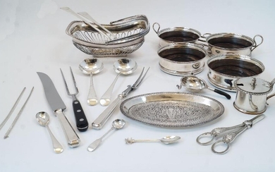 A group of silver plate, to include: a cake basket of pierced form with swing handle, 24cm wide; a double wine coaster, with turned wood interiors and baize lined bases, having engraved horse head crests to sides, 33cm wide; two similar individual...