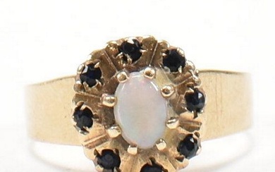 A hallmarked 9ct gold, sapphire and opal cluster ring. The r...