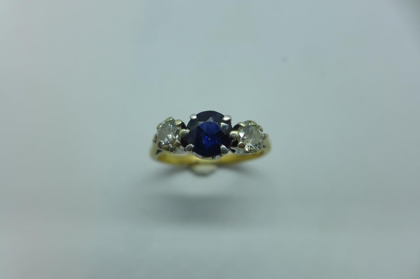 A hallmarked 9ct yellow gold diamond and sapphire ring, size...