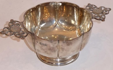 A hallmarked silver two-handled porringer, assayed London 1900