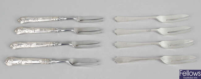 A large assortment of cutlery, comprising teaspoons, cake forks, sugar tongs, etc.