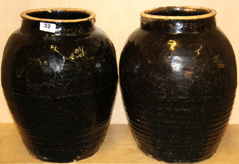 A large pair of early Chinese Honan glazed stoneware vases, H. 38cm, Dia. 28cm.