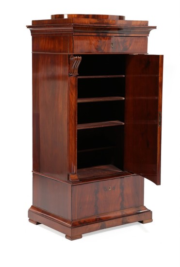 A late 19th century Empire style mahogany pedestal cabinet, front with two drawers and convex door. H. 141. W. 72. D. 51 cm.