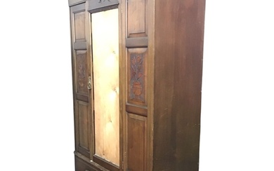 A late Victorian mahogany wardrobe, the dentil cornice above a...