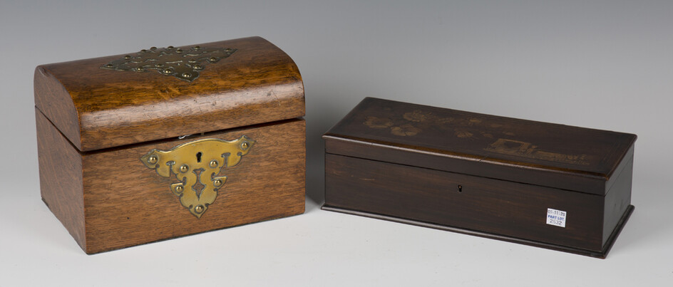 A late Victorian oak and brass mounted dome-topped tea caddy, the interior with twin-lidded compartm