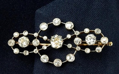 A late Victorian palladium and gold old-cut diamond bow brooch.Estimated total diamond weight