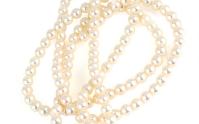 A long pearl necklace set with numerous Akoya cultured pearls and a...
