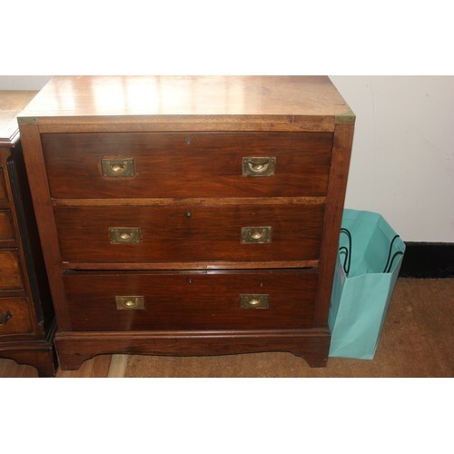 A mahogany Military style chest of three drawers, with brass...