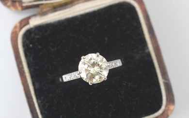A mid 20th century diamond solitaire ring, the central round...