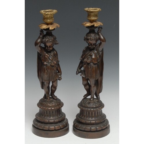 A pair of 19th century French brown-patinated bronze figural...
