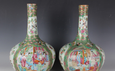 A pair of Chinese Canton famille rose porcelain bottle vases, mid-19th century, each typically paint