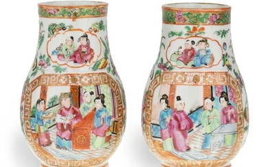 A pair of Chinese Canton famille rose porcelain vases, 19th century, each of pear shape form with a short foot rising to a wide neck with a rib to the shoulder, painted to the front and back with a panel decorated with gilt border depicting figures...