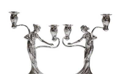 A pair of German Art Nouveau silvered-pewter candelabra
