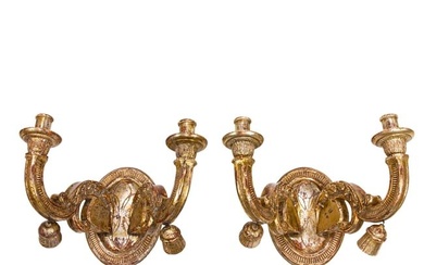 A pair of Italian Baroque style silver gilt two-arm wall lights, 19th century, each oval back plate