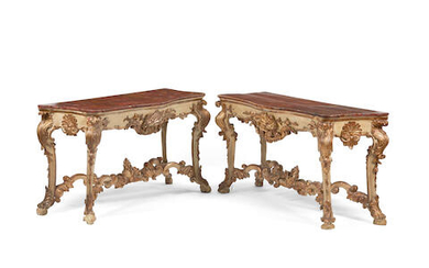 A pair of Italian baroque gilt and painted wood consoles