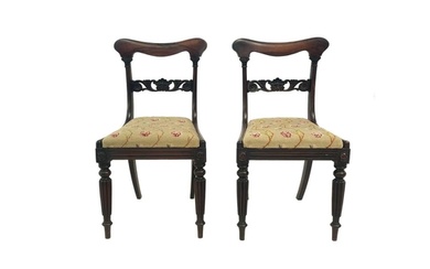 A pair of Regency rosewood side chairs. With shaped curved t...