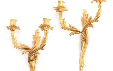 A pair of Rococo style gilt bronze bracket lamps, each with two branches. 20th century. H. 36 cm. (2)
