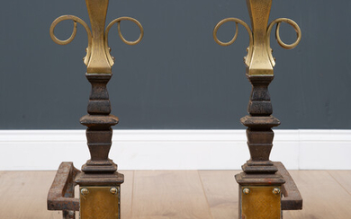 A pair of Victorian brass and cast iron fire dogs...