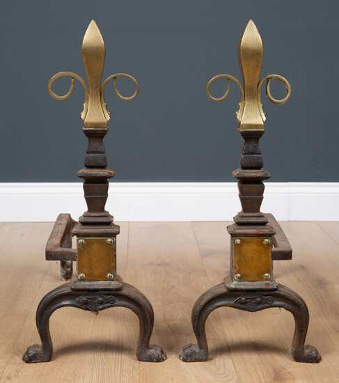 A pair of Victorian brass and cast iron fire dogs...