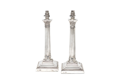 A pair of Victorian silver lamps