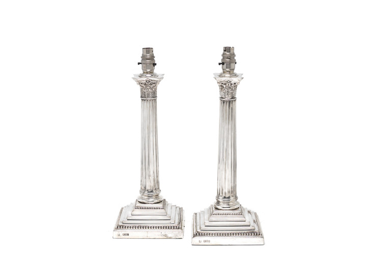A pair of Victorian silver lamps
