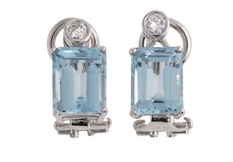 A pair of aquamarine and diamond ear clips, each claw set with a rectangular aquamarine to a brilliant-cut diamond surmount, clip fittings, length 1.5cm