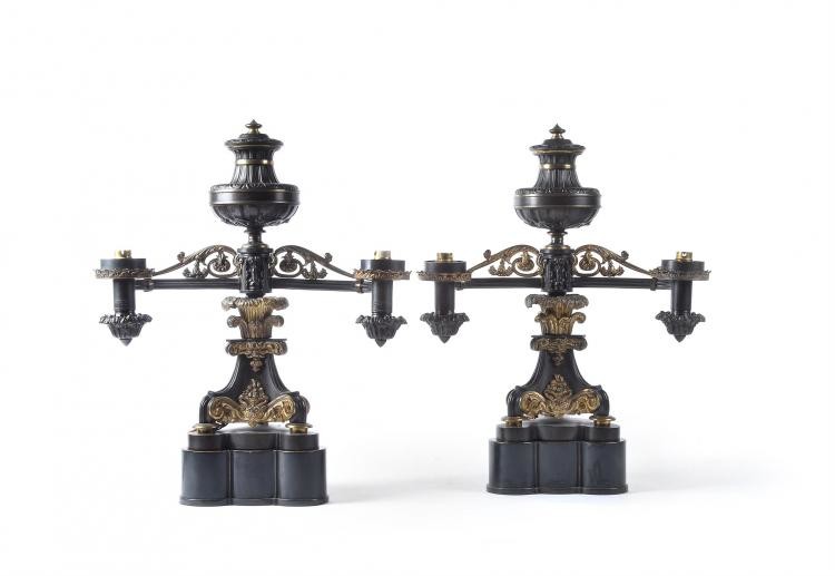 A pair of fine William IV parcel gilt and patinated metal twin light Argand table lamps, circa 1830 and later adapted for electricity
