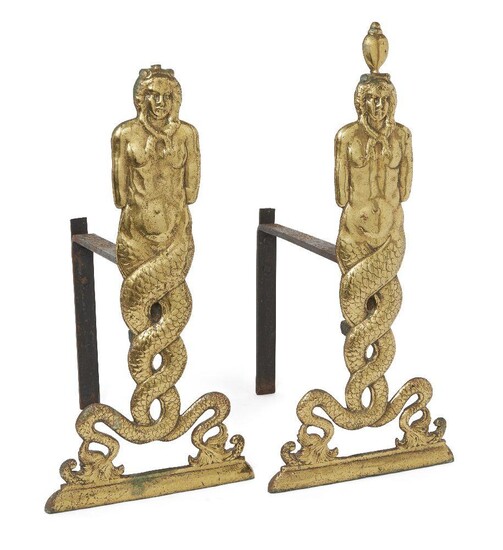A pair of polished brass figural andirons, 19th century, each modelled as a sea goddess with entwined tails, with iron billet bars, 58cm high, 39cm deep (2) Provenance: The estate of the late designer, Anthony Powell.