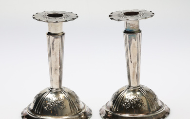 A pair of silver candlesticks, filled, Pewter and Silver Göteborg.