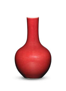 A red-glazed bottle vase