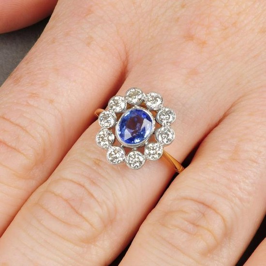 A sapphire and diamond cluster ring. Sapphire